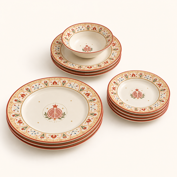 KLAYCO Pomegranate Constellation 12-piece dinnerware set on warm white